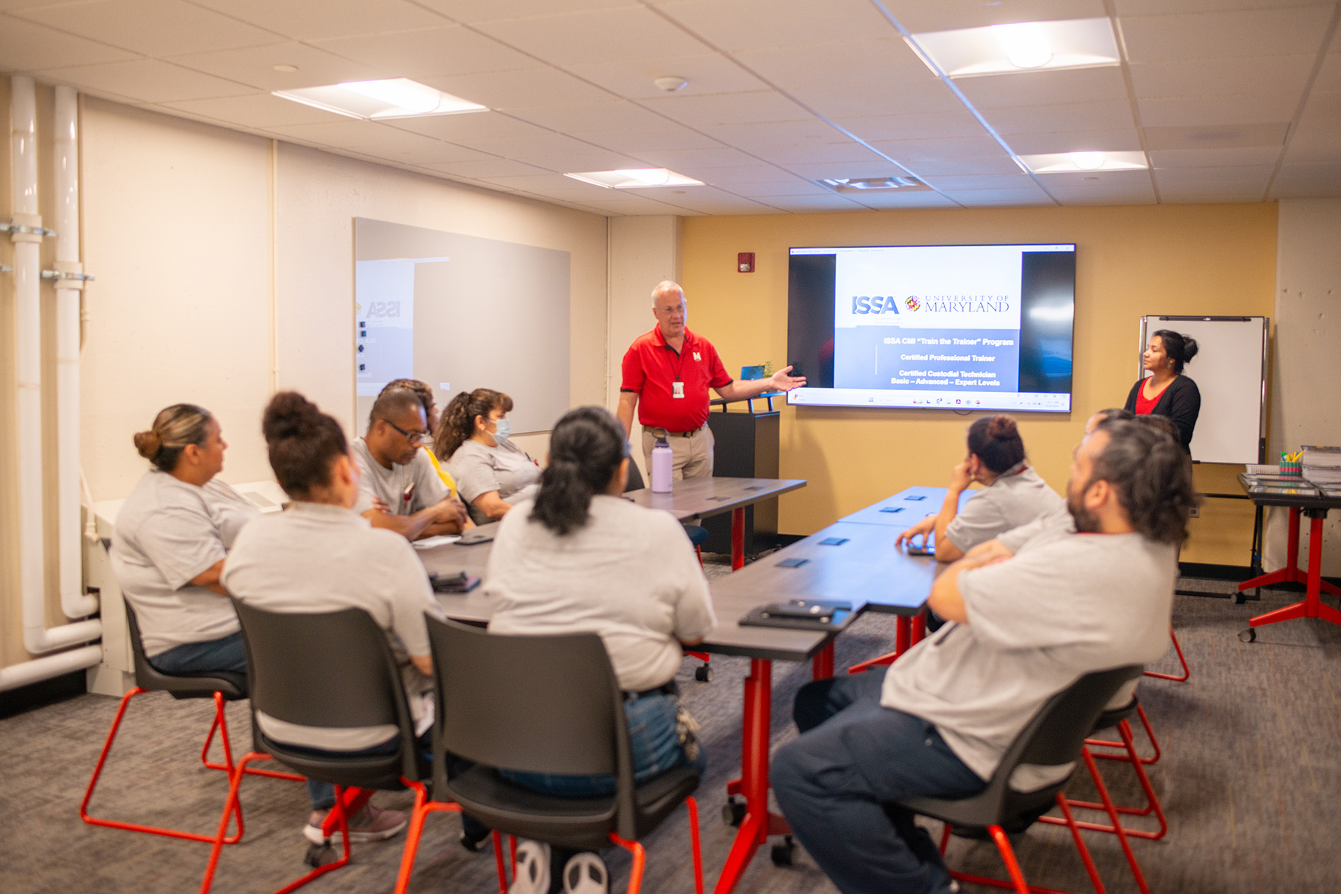 Vassie Hollamon speaking to housekeeping team