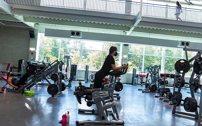 students using weight machines inside Eppley