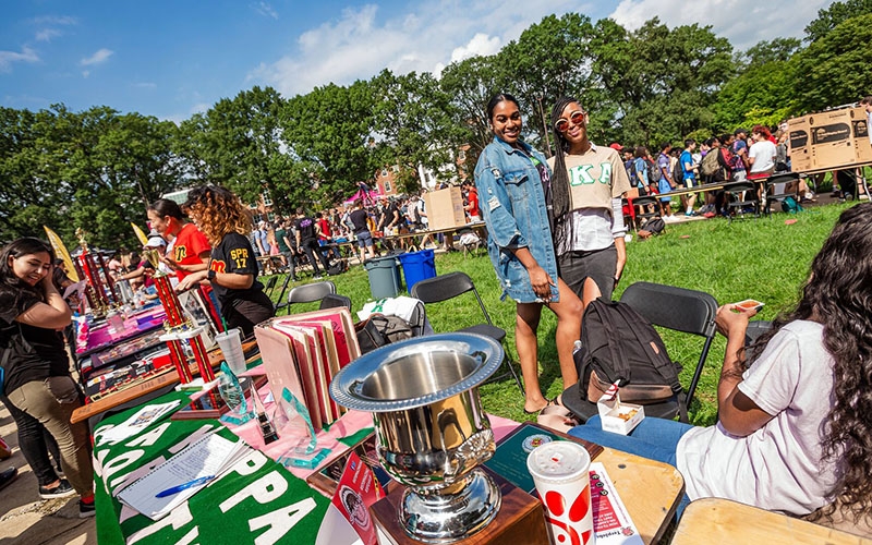 Female student members of the Alpha Kappa Alpha Sorority posing for a picture during the 2018 First Look Fair on the Mall.