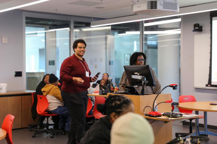 Sharon Dawes and Roy Delgado presenting on Google Calendars in front of a classroom