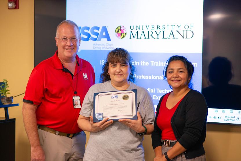 Yanira Molina  receiving certification from Vassie Hollamon and Isabel Marroquin