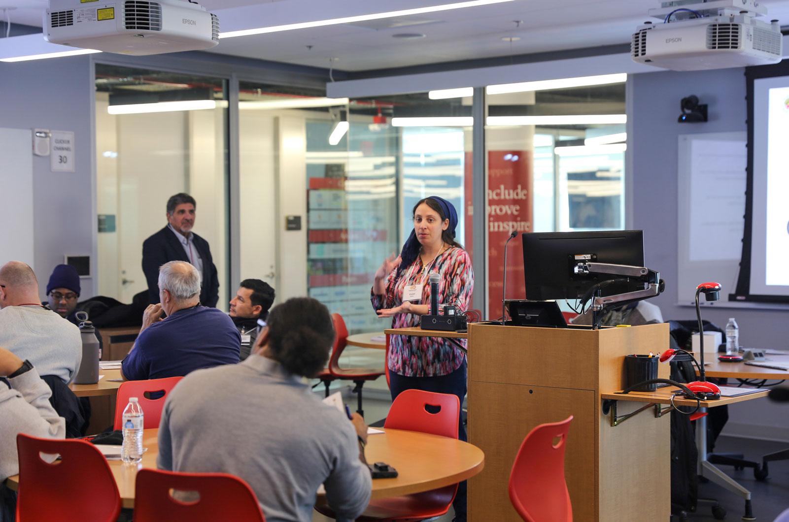 Violet Battat presenting in a classroom