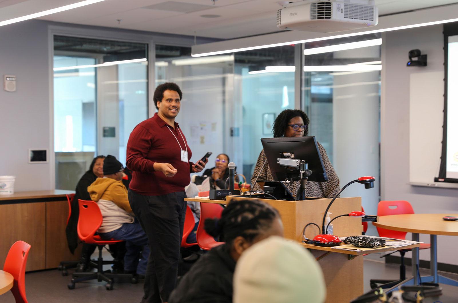 Sharon Dawes and Roy Delgado presenting on Google Calendars in front of a classroom