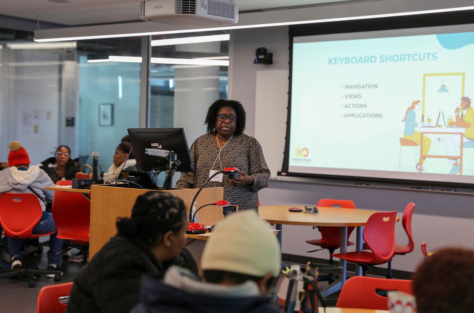 Sharon Dawes presenting in front of classroom