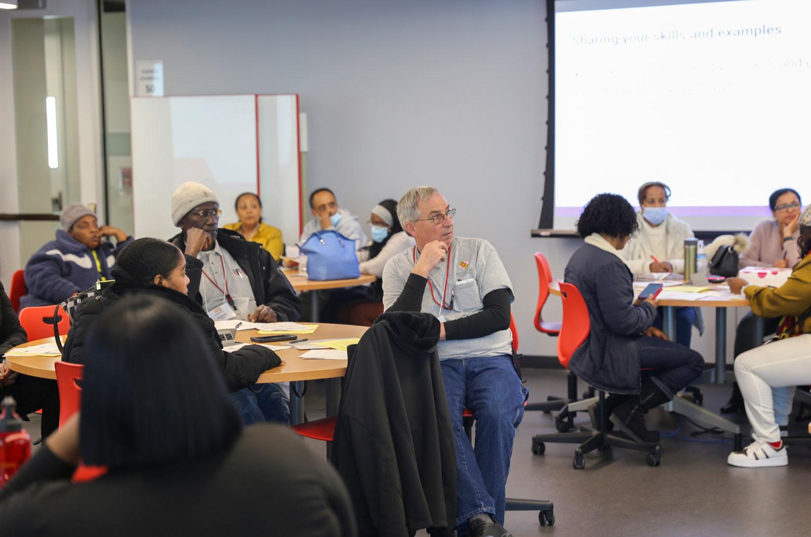 Attendees listening to Cindy present on job interviews