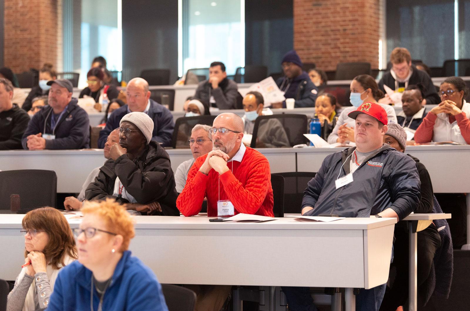View of interior auditorium with attendees at the DRF Town Hall