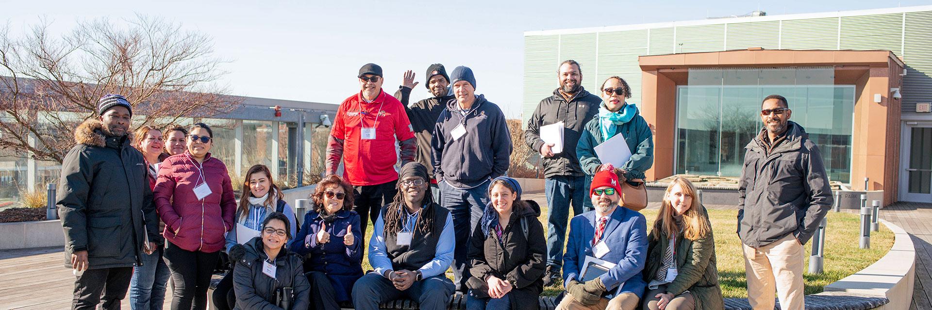 group of Residential Facilities staff on roof of Iribe 