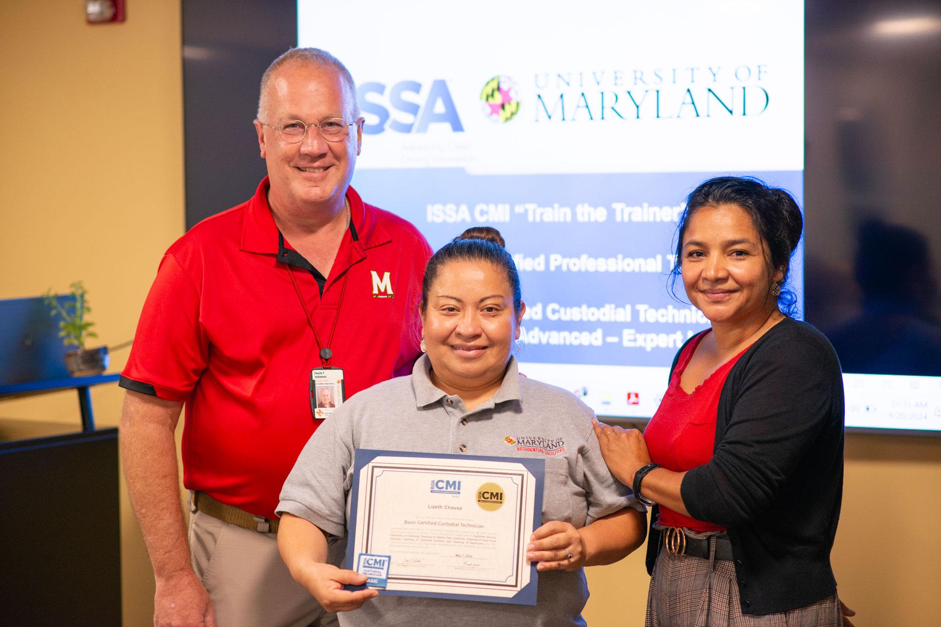 Lizeth Chavez  receiving certification from Vassie Hollamon and Isabel Marroquin