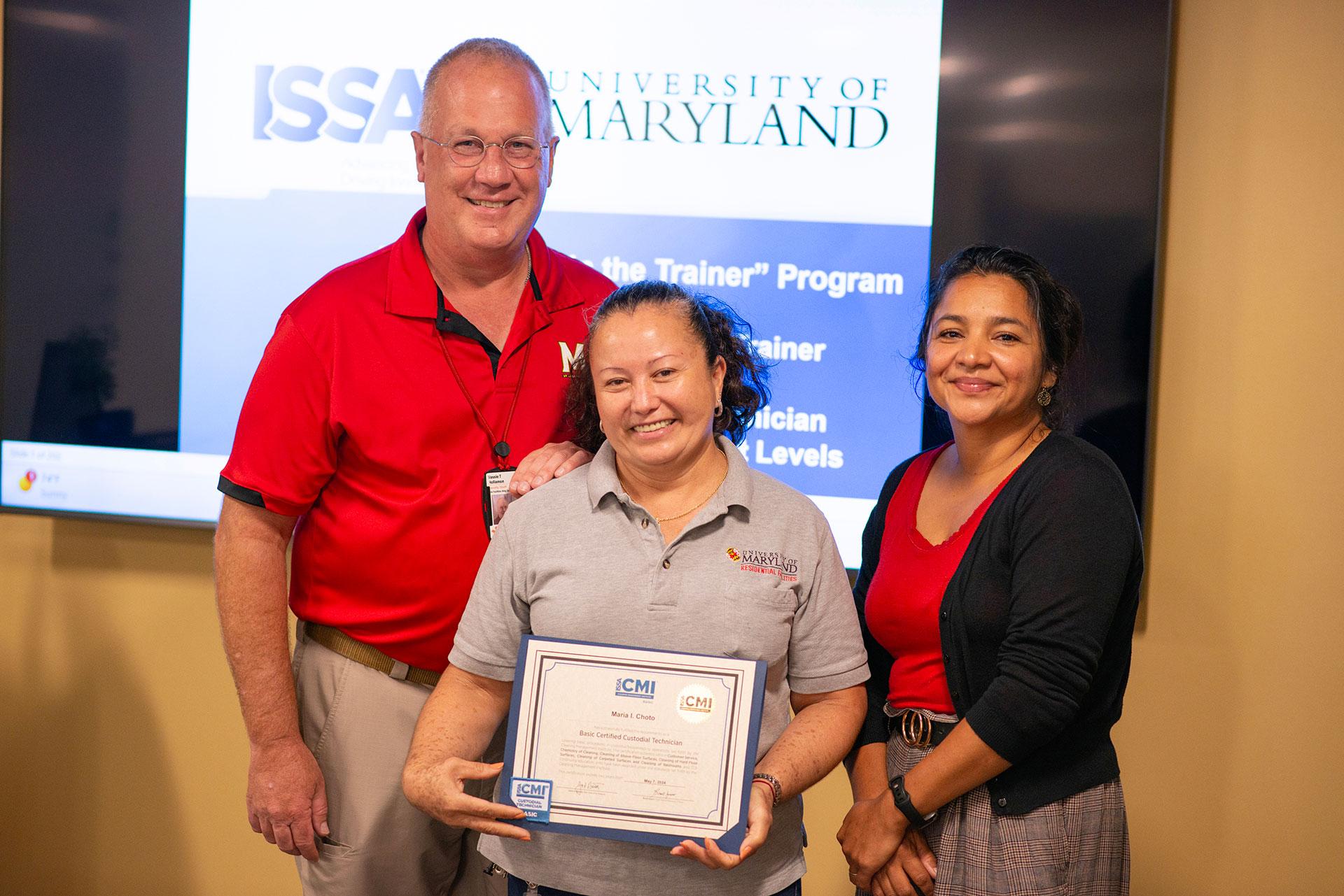 Maria Choto  receiving certification from Vassie Hollamon and Isabel Marroquin