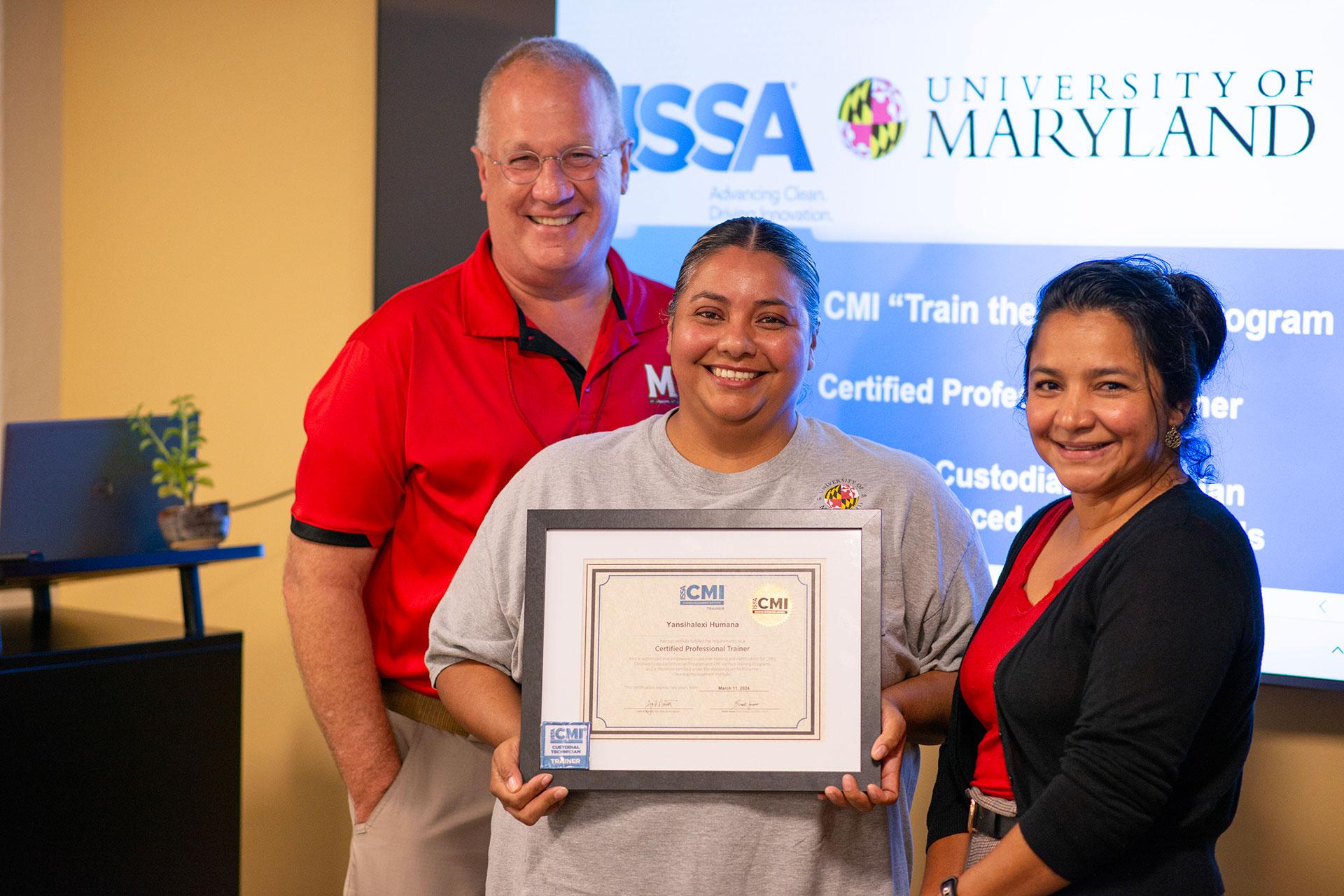 Yansihalexi Humana  receiving certification from Vassie Hollamon and Isabel Marroquin