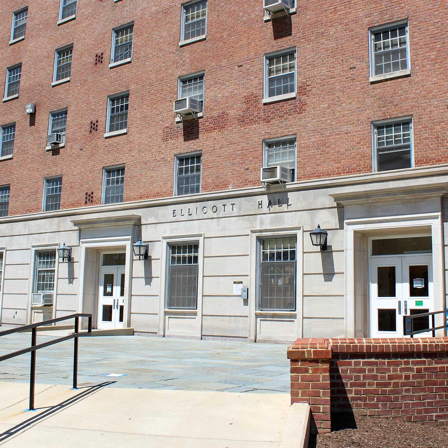 Exterior of Ellicott Hall, a multi-story brick building with stone entrance.